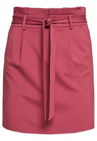 Sukně v barvě mauve s vysokým pasem, předním zavazovacím páskem, bočními kapsami a jemnými sklady pod pasem.