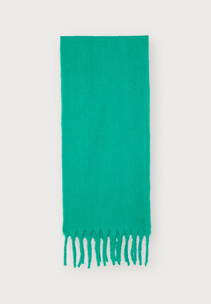 Green fringed scarf made of soft fabric, featuring a solid color design and a textured finish. Measures approximately 70 cm by 180 cm.