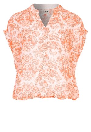 Blouse à manches courtes boutonnée avec motif floral orange sur tissu blanc, col en V et coupe décontractée.