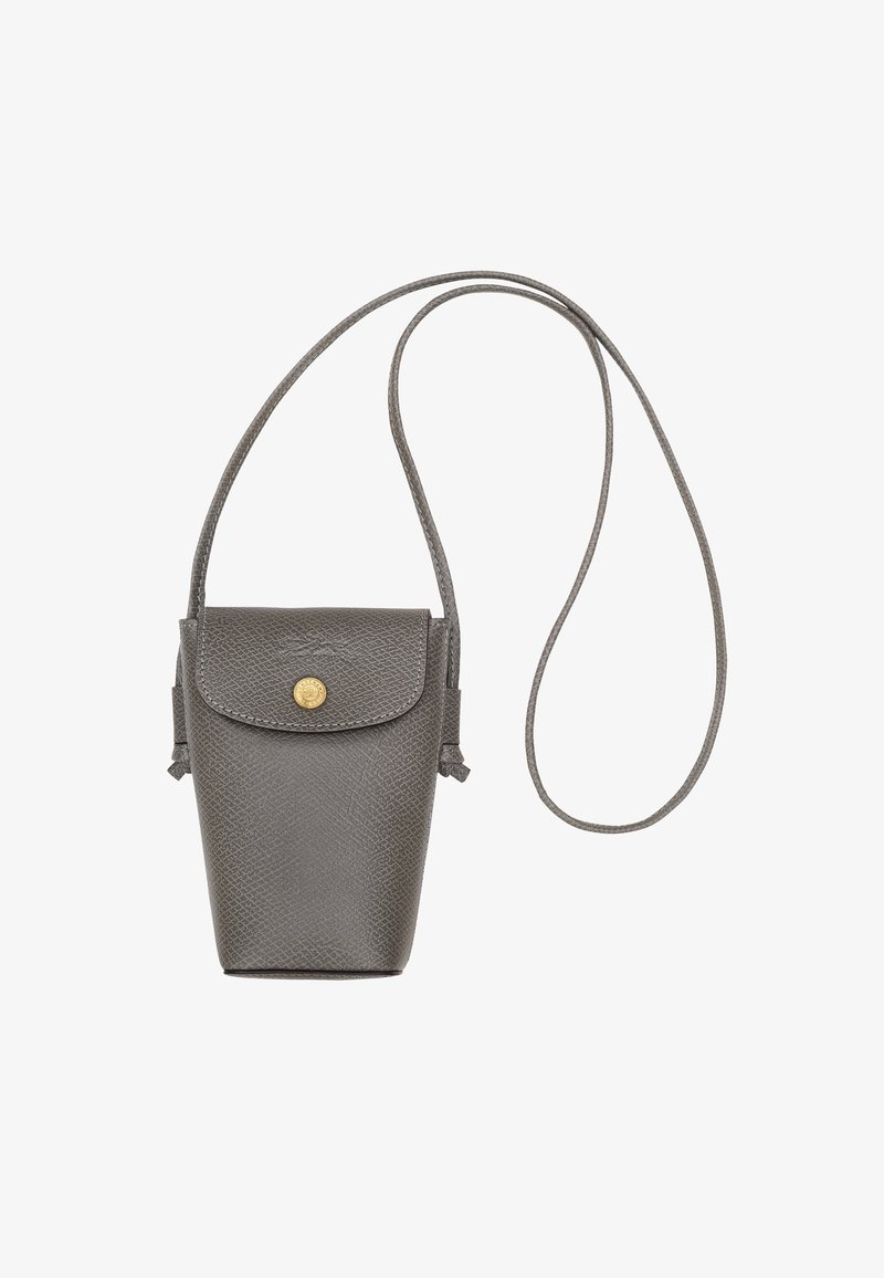 Gray leather handbag with a structured design, a magnetic closure, and a long strap for wearing crossbody. Textured surface and gold hardware accent.