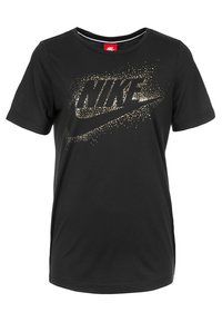 Černé tričko s krátkým rukávem vyrobené z měkké tkaniny, které má na přední straně velké zlaté glitrové logo Nike se dynamickým rozstřikem.