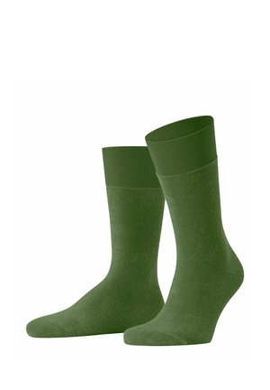Grüne Baumwollsocken mit einem gerippten Bund und einer glatten Textur. Sie haben eine standardisierte Form mit verstärkten Zehen- und Fersenbereichen.