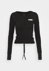 Schwarzes langärmliges Crop-Top mit Rundhalsausschnitt, verstellbarem gerafftem Fronttie und weißem "PUMA"-Logo auf der oberen linken Brust.