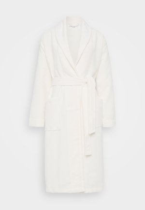 White, plush bathrobe with a shawl collar, belted waist, and two front pockets. Soft texture and knee-length design.
