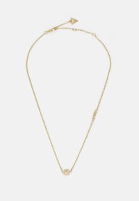 Gold chain necklace featuring a round, textured pendant adorned with decorative elements. Adjustable length with clasp and logo tag.