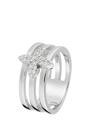 Silberner Ring mit drei parallelen Bändern und einem blumenförmigen Cluster aus kleinen klaren Edelsteinen obenauf.