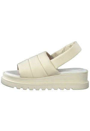 Cremfarbene Plateausandalen mit gepolstertem Riemendesign, offener Zehenpartie und strukturiertem Profil für einen guten Halt. Verfügt über eine gepolsterte Ferse für zusätzlichen Komfort.