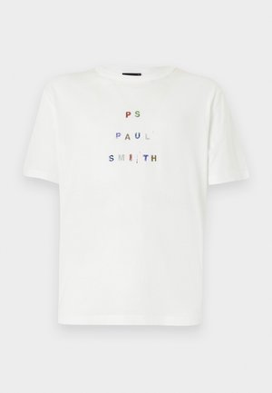 T-shirt en coton blanc avec un texte multicolore en sequins portant "PS PAUL SMITH" dans un design en lettres majuscules. Coupe décontractée, col rond.