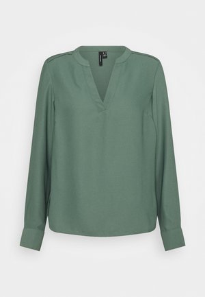 Grüne, langärmlige Bluse mit V-Ausschnitt und ärmellosem Design, ausgestattet mit geknöpften Manschetten und Ärmelnaht-Details.