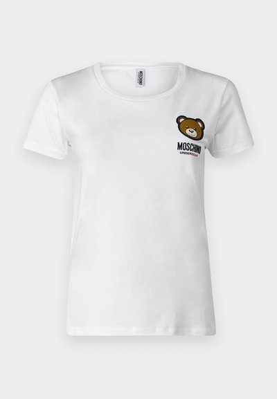 T-shirt branca de algodão com decote redondo, mangas curtas e um gráfico de um urso castanho no lado esquerdo do peito, acompanhado do texto "Moschino Underbear".
