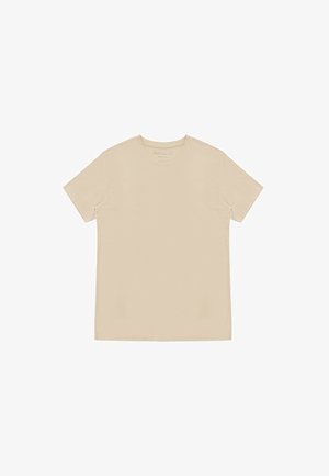 Beżowa koszulka z krótkim rękawem i okrągłym dekoltem, ułożona płasko na białym tle, z widocznymi szwami i gładką fakturą materiału.