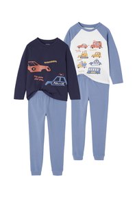 Two children's pajama sets with blue pants; one navy top with police and car illustrations, one white and blue top with various vehicle illustrations.