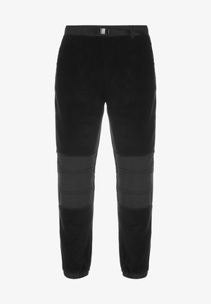 Pantalones de forro polar negros con un ajuste ceñido, que presentan una textura contrastante en las rodillas y un lazo para cinturón en la cintura para un ajuste ajustable.