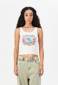 Ribbed white tank top featuring a colorful graphic print with flowers and waves, paired with high-waisted light green jeans.