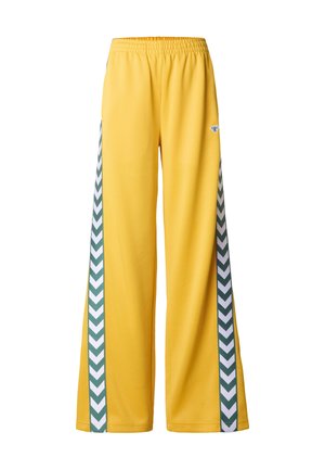 Pantalon jaune à jambes larges avec une taille élastique, présentant des rayures vertes à motif chevron sur les côtés et un petit détail de logo.
