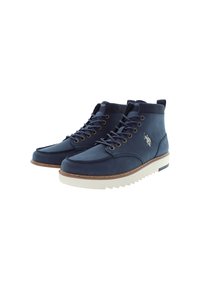 Ett par marinblå läderhögskor med vita räfflade sulor och snören, med en vit logotyp på sidan.