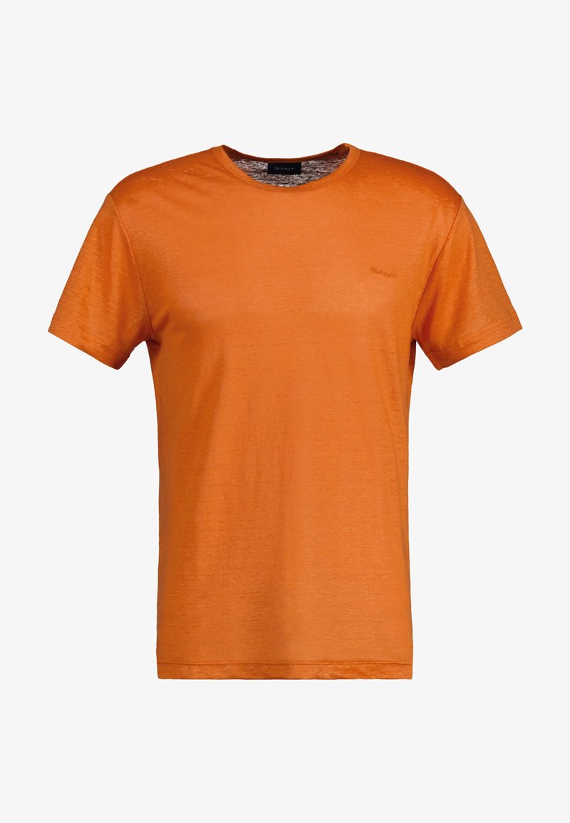Orange crew neck t-shirt made of lightweight fabric. Short sleeves, smooth texture, and a small logo on the chest. Classic fit.