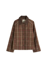 Brūns raibums žakete ar korduroja apkakli, pieci pogas, divas sānu kabatas un garas piedurknes. Iezīmējas ar smalku sarkano rūtiņu rakstu.