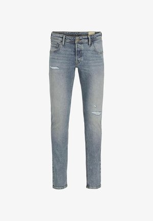 Jeans in denim blu chiaro con vestibilità slim, caratterizzati da dettagli strappati sulla parte anteriore, cinque tasche e una vita standard con chiusura a bottone.