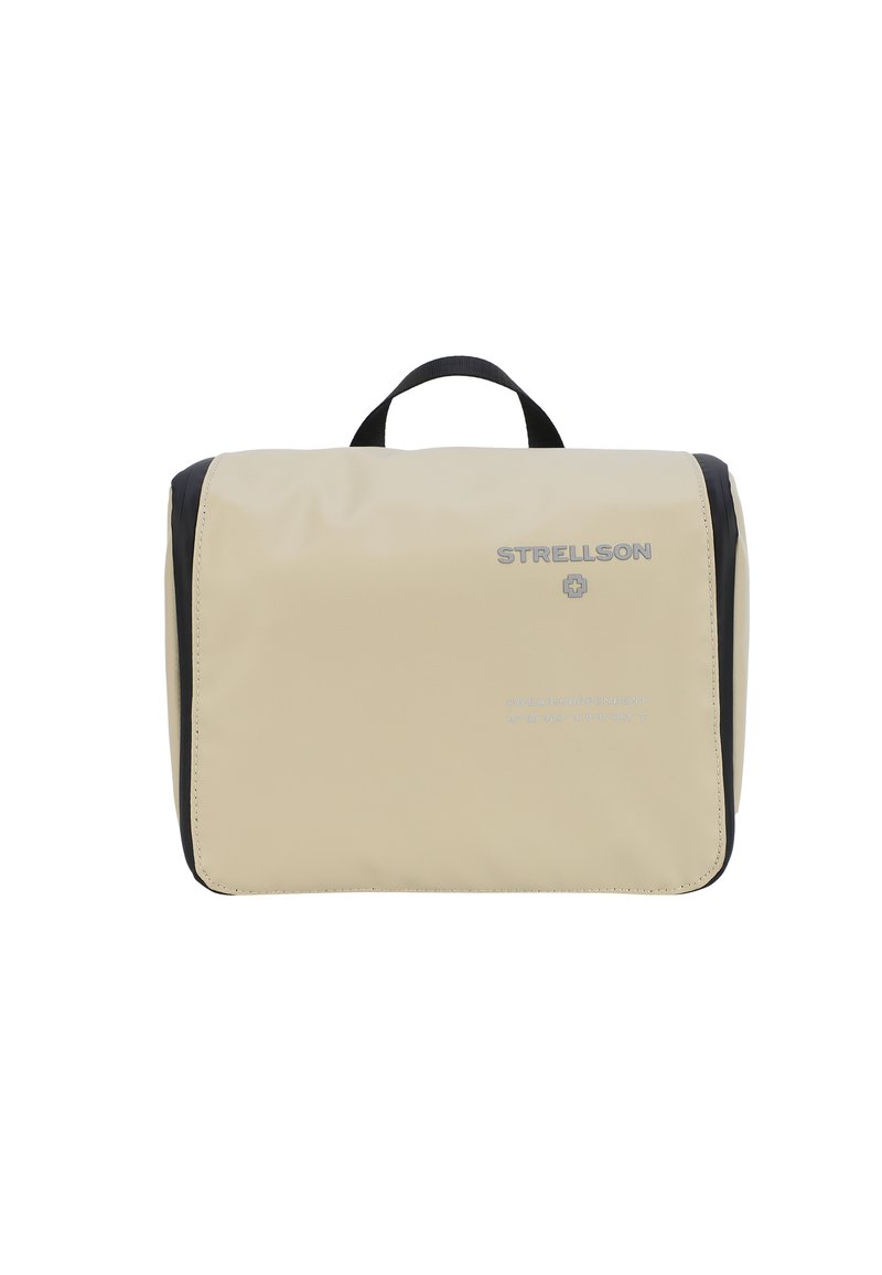 Beige vattentät necessär med svart kant, handtag på toppen och tryckt logotyp. Har en slät yta och en rektangulär form.