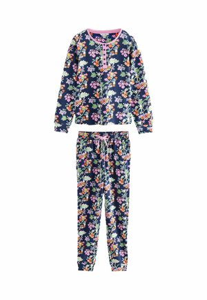 Ensemble de pyjama en coton fleuri avec un haut à manches longues et un pantalon à taille élastique, présentant un fond bleu marine et des finitions roses.