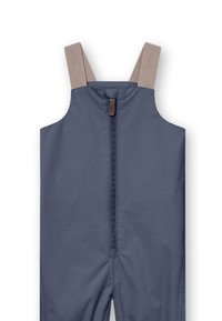 Marineblauwe waterdichte overall met verstelbare beige banden, rits aan de voorkant en een gladde, duurzame stofstructuur.