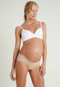 White maternity bra with soft cups and lace detailing, paired with beige seamless underwear, highlighting a smooth texture and supportive design.