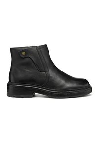 Bottine en cuir noir avec une texture lisse, panneau élastique sur les côtés et bout arrondi. Dotée d'un petit talon et d'un subtil accent doré près de la cheville.