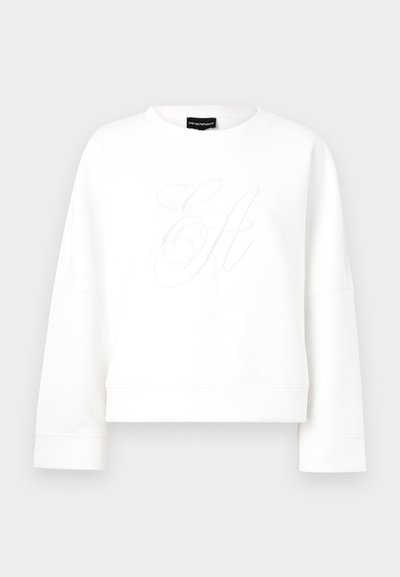 White cropped sweatshirt in soft material featuring a subtle embossed monogram. Classic round neckline and relaxed long sleeves.