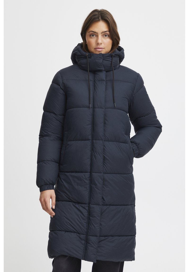 Navy blue puffer coat featuring a quilted pattern, high collar with drawstrings, and elastic cuffs. Mid-calf length, smooth texture.