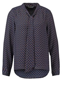 Blusa a maniche lunghe blu navy con piccolo motivo floreale arancione e scollo con fiocco anteriore, orlo arrotondato.