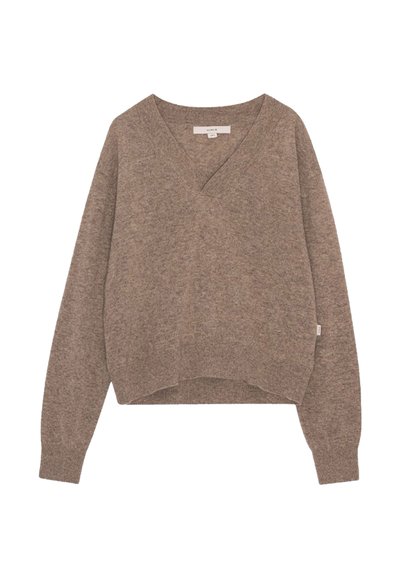 Maglioncino marrone chiaro a maglia con scollatura a V e maniche lunghe. Presenta un design croppato e un tessuto leggermente strutturato.