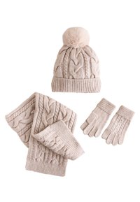 Beige knit winter hat with pom-pom, gloves, and scarf, featuring cable patterns and ribbed accents. Soft texture; set for cold weather.