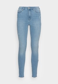 Jeans ajustados de color azul claro, hechos de denim, con una cintura alta, diseño de cinco bolsillos y detalles sutiles de desgaste en las piernas.