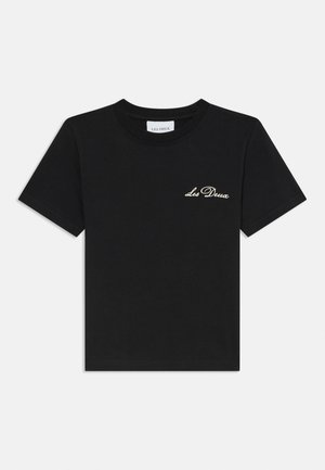 Czarny bawełniany t-shirt z okrągłym dekoltem. Posiada złoty napis "Les Deux" na lewej stronie klatki piersiowej. Krótkie rękawy i standardowy krój.