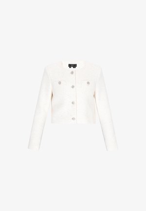 Chaqueta blanca corta con mangas largas, fabricada con un tejido texturizado, que cuenta con dos bolsillos frontales y detalles de botones de cristal.