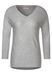 Hellgrauer Damenpullover aus weichem Strickstoff. Mit V-Ausschnitt, langen Ärmeln, gerippten Bündchen und einem geraden Saum mit einer dezenten Mittelnaht.