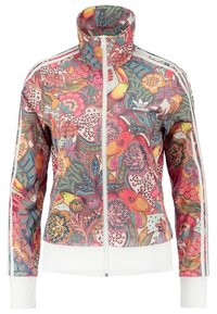 Kurtka dresowa w kwiatowy wzór z wysokim kołnierzem, zamkiem błyskawicznym i białymi ściągaczami na rękawach. Wykonana z lekkiego, kolorowego materiału.