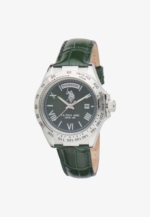 Montre-bracelet en acier argenté avec un cadran vert, des accents argentés, un bracelet en cuir à motif crocodile vert, et affichage du jour/date à 3 heures.