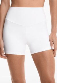High-waisted white shorts made from stretch fabric, featuring a smooth texture, fitted design, and clean, simple lines without patterns.