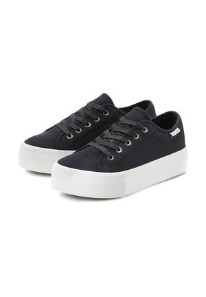 Black canvas sneakers with white rubber platform soles, round toe, and gray laces. Features silver eyelets and a subtle logo tag on the side.