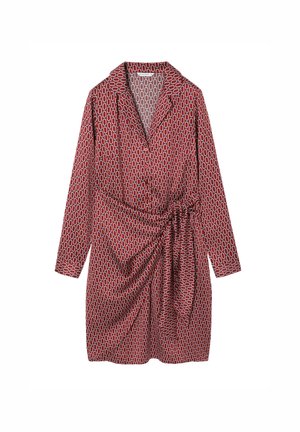 Punane mustriga kleit, millel on krae, pikad varrukad ja seotud vöödetail. Kangas on kaunistatud valge abstraktse ovaalse mustriga.