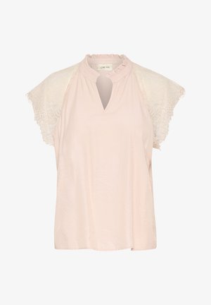 Light pink blouse with a ruffled neck, deep V-cut, and sheer lace cap sleeves. Soft fabric with smooth texture and casual silhouette.