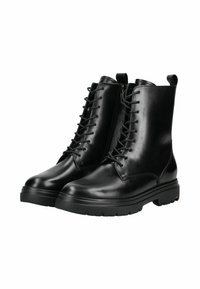 Bottines en cuir noir avec une finition lisse, dotées d'un laçage à l'avant, d'un bout arrondi et d'une semelle en caoutchouc épaisse. Agrémentées de languettes d'enfilage.