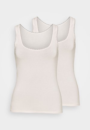 Two sleeveless tank tops in light beige, featuring a rounded neckline and delicate trim along the edges. Made from soft cotton fabric.