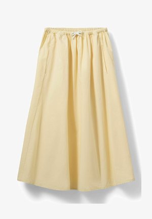 Light yellow, mid-length skirt made of soft fabric. Features an elastic waistband with drawstring, and two side pockets. Smooth texture.
