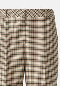 Pantaloni a scacchi beige con accenti neri e marroni, caratterizzati da un taglio diritto, una texture liscia e una leggera brillantezza in vita.