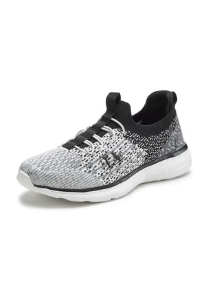 Black and white knitted athletic shoe with a flexible upper, textured pattern, elastic laces, and a cushioned white sole.