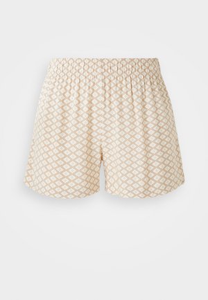 Beige mønstrede shorts med elastisk talje; har små hvide blomsterdesigns i et diamantgitterlayout. Glat tekstur, afslappet pasform.