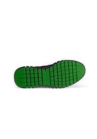 Black shoe sole with green rubber tread, featuring horizontal and vertical grooves for traction, and a slightly raised toe section.